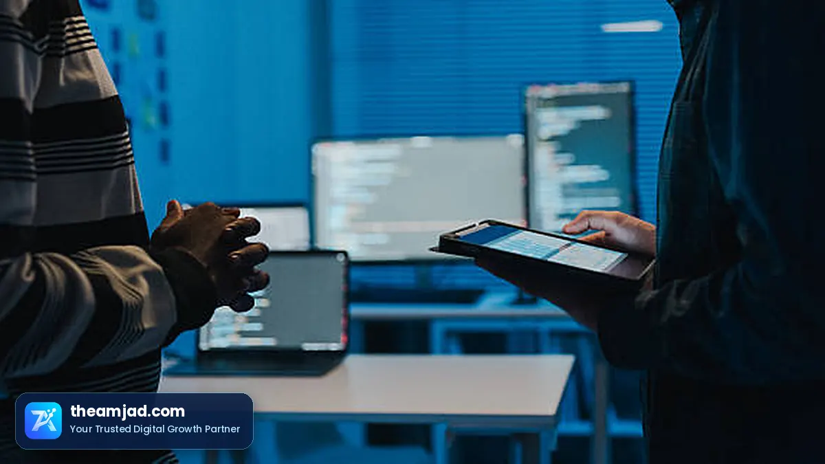 Web development course: code on developer monitors during a WordPress build